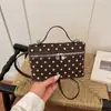 Bolso pequeño cuadrado de lunares de moda transfronterizo para mujer 2026 verano nuevo diseño de nicho bolso de mano de un solo hombro bolso cruzado para mujer