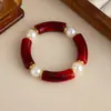 Pulsera elástica de resina curvada teñida de rojo de Angola, pulsera de moda retro de alta gama, joyería transfronteriza europea y americana para mujer
