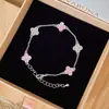Pulsera de Flor de Trébol de Cuatro Hojas de Placa de Circonio Lujo Ligero Anillo de Mano de Gama Alta Nicho Único Exquisito Joyería de Mano