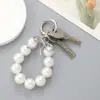 Moda Nuevo Cuentas Plateadas UV Lazo de Cinta Colgante para Bolso Accesorios para Colgar Funda de Teléfono Móvil Llavero Accesorios Colgantes
