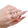 Joias Mu Jing novo anel de prata S925 banhado a ouro com incrustação de diamante de alto carbono corte flor de gelo oval 8*12 anel cruzado venda quente transfronteiriça