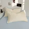 Juego de cuatro piezas estilo coreano minimalista con borde de concha en color liso, hecho de tela de algodón lavado, adecuado para la habitación doble de una niña, ropa de cama para todas las estaciones