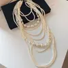 Collar redondo de perlas con cuentas estilo francés, sensación de lujo ligero y alta gama, cadena de suéter de doble capa, accesorio de nicho de diseño único para mujer
