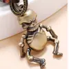 Chaveiro retrô de robô de desenho animado tecelão móvel, caveira de bronze, couro de vaca, joia pequena criativa e simples