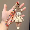 Boneca de tecido estilo floresta urso enfeite de pendurar chaveiro de corda trançada feito à mão pingente estilo artístico decoração de bolsa pingente versátil