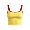 Conjunto de entrenamiento Pilates adelgazante para mujer, con un top tipo camisola de bloques de color y shorts atléticos de cintura alta, plisados y anti-exposición.