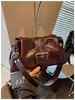 Bolso de hombro simple y relajado estilo coreano, bolso de axila para el trabajo y los desplazamientos, nuevo bolso cruzado elegante para principios de la primavera de 2026