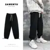 Pantalones casuales de talla grande para hombre para primavera y otoño, estilo coreano moderno, versátiles para estudiantes, corte holgado, color liso, con cordón, joggers deportivos