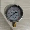 Manómetro YN60 resistente a golpes G 1/4 cabeza de manómetro radial llena de glicerina y aceite de silicona, rosca estándar británica, salida de 1/4 de pulgada, manómetro transfronterizo