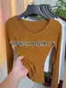 Camiseta Base de Algodón Canalé Naranja Calabaza Adelgazante con Cuello en V para Mujer, Versátil Top de Manga Larga Moda Primavera/Verano 2026