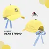 Boné de Baseball com Laço Estilo Coreano, Estampa Xadrez, Bordado de Cachorro Fofo para Mulheres, Novo Design Versátil Que Faz o Rosto Parecer Menor