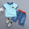 Novo conjunto de verão para bebê e criança, manga curta, gola alta, estampa completa de letras, camisa polo de manga curta, shorts, conjunto de duas peças Geração cabelo