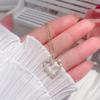 [Acero de titanio con baño de oro real] Collar de circonitas con incrustaciones de amor, nuevo diseño en forma de corazón, cadena de clavícula de nicho simple.