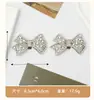 Ventas directas transfronterizas de tacones altos desmontables con flores de zapato de pedrería, hebillas de lazo brillantes y clips metálicos para zapatos.