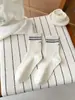 Calcetines sin costuras 2026 para mujer, calcetines de algodón de media pantorrilla para primavera con rayas bordadas en el talón, calcetines holgados estilo coreano sin costuras