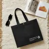 Sacolas de compras ecológicas de TNT com fivela para lojas de roupas, sacolas espessadas para vestuário masculino e feminino, embalagem por atacado, novo material para compras