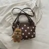 Nova bolsa balde retrô minimalista, bolsa casual fashion, bolsa de ombro e transversal feminina texturizada nova do outono de 2026