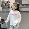 Capa base de longitud media para primavera y otoño 2026 Nuevo estilo para niños Camiseta de algodón puro Muy bonita Moderna Camiseta de manga larga para niñas