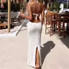 Europa e Estados Unidos transfronteiriços sexy oco tridimensional crochê tricô alça de pescoço cintura oca slim fenda blusa saia de férias