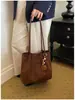 Bolso tote de diseño de nicho retro nuevo transfronterizo para mujer, gran capacidad, simple y elegante, color liso, adecuado para el trabajo, bolso de hombro