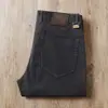 Estación europea otoño e invierno pantalones de algodón gruesos color caqui sarga elástica para hombre de negocios pierna recta pequeña vaqueros casuales