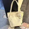 Bolsa de lona estilo japonés de alta calidad y elegante, perfecta para el uso diario, con gran capacidad, adecuada para estudiantes y viajeros, y se puede llevar como bolso de hombro.