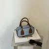 Nova moda outono de 2026, bolsa Boston simples texturizada, bolsa de ombro e transversal vintage de alto valor em formato de travesseiro