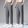 2024 Verão Nova Calça de Seda Gelo Homens Cor Sólida Moda Marca Calças Esportivas Folgadas Justas Casual All-match Calças Masculinas