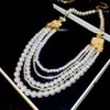 Pendientes y collar de perlas con incrustaciones de diamantes estilo corte francés para mujer, cadena para la clavícula de lujo ligero de alta gama, exquisito juego de joyería vintage