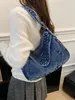 Bolso de hombro casual y de moda con remaches estilo coreano 2026, bolso de mezclilla diario para mujer