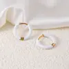 Brincos de aço inoxidável transfronteiriços Série colorida ear cuffs com óleo drop Venda direta da fábrica atacado Ouro 18k Tarraxas de aço de titânio para mulheres