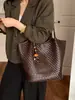 Bolso tote grande de patrón tejido transfronterizo para mujer, nuevo modelo 2026, bolso de hombro de color liso simple y elegante estilo coreano de nicho