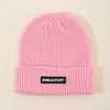 Gorro de Tela Tejida Gruesa con Etiqueta para Hombres y Mujeres Otoño e Invierno 2025 Nuevo Gorro de Lana Tejida Gorro Cálido de Invierno con Protección para los Oídos Gorro para el Frío