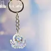 Nuevo Colgante Creativo de Bolsa con Cara Sonriente de Pulpo Brillante Dibujo Animado Pequeño Regalo Llavero de Moda Anillo de Llave