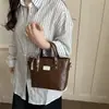 Bolso Pequeño para Mujer 2026 Primavera y Verano Nuevo Estilo Textura de Alta Gama Diseño de Nicho Retro Versátil Bolso Cruzado Bolso de Cubo de Mano