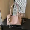 Bolso tejido de cuero para mujer, simple y elegante, versión coreana, bolso de hombro casual de nicho, bolso para axila madre e hija, bolso tipo cesta