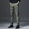 Hong Kong 2026 Outono Novas Calças Casuais Masculinas Slim Fit Estilo Coreano Elásticas Versáteis Calças Masculinas de Alta Qualidade para Primavera e Outono