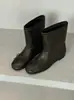 Botas estilo coreano, bico redondo, adornadas com laço, elásticas, de ajuste justo - a coleção de inverno de 2026 apresenta botins versáteis, de sola reta e que afinam o tornozelo