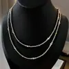 Accesorios de collar de perlas pequeñas Shijia para mujer, cadena de clavícula de cuentas de verano, cadena para el cuello de lujo ligero de nicho de alta gama