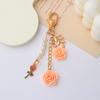 Llavero con borla de flor de camelia de resina estilo Ins, colgante de flor de hoja, colgante decorativo para bolsa de auriculares de niña