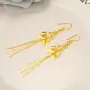 Aretes Chapados en Oro con un Diseño de Moda Único con Estrellas y Notas Musicales, un Accesorio Sencillo de Estilo Largo para Niñas, con Borlas Doradas para un Aspecto Elegante