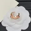 Anillo de Diseñador Nuevo Estilo Europeo y Americano Transfronterizo con Logo y Diseño Floral Incrustado de Diamantes para Mujer, Sensación de Alta Gama, Fotos Reales, Anillo Ajustable, Venta al por Mayor