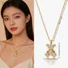 Collar de Oso Pequeño con Circonita Brillante Cruzada Lujo Ligero Nicho Sensación de Alta Gama Colgante Asequible Accesorios de Acero de Titanio de Comercio Exterior Mujer Verano