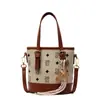 Versão Coreana da Nova Bolsa de Balde Portátil de Moda Clássica Estampada de Alta Qualidade, Bolsa Transversal de Temperamento Nicho para Mulheres Estilo Comutador