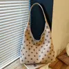 Bolsa de ombro tote com poá para axila, design de moda estilo coreano transfronteiriço para mulheres, nova bolsa de mão e bolsa de ombro versátil para o dia a dia 2026