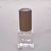 5ml Venta al por mayor de fábrica Botella para decantar perfume Tapa cuadrada de madera maciza Botella de perfume mini portátil Atomizador de niebla fina Botella vacía de vidrio