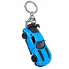 Llavero creativo de mini coche deportivo de fricción, coche de aleación con puertas que se abren, accesorio para mochila infantil, regalo de coche