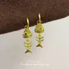 Sistema de color Maillard retro nicho minimalista de alta gama aretes de mariposa para otoño e invierno versátiles simples para el día a día