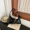 Bolsa de ombro retrô estilo coreano para mulheres, nova coleção outono/inverno 2026, moderna e única, bolsa de ombro minimalista para o dia a dia, bolsa transversal