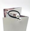 Versión coreana de la banda plana de cuerda anudada, lindo anillo para el cabello con perla grande, tienda de 2 yuanes, fabricantes proveedores de accesorios para el cabello